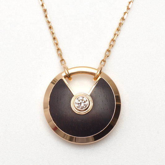 Sautoir Cartier Amulette PM en or rose et bois d'amourette