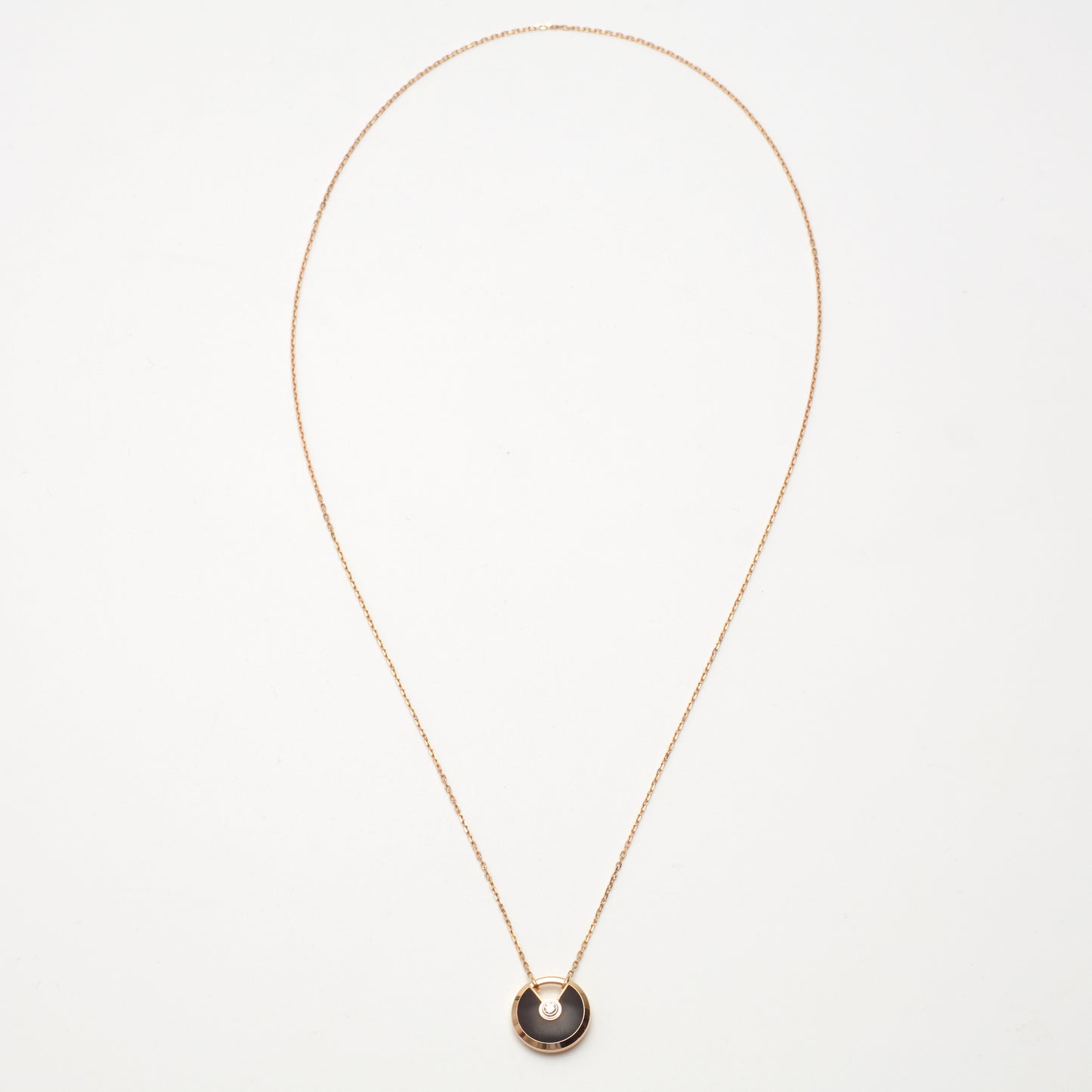 Sautoir Cartier Amulette PM en or rose et bois d'amourette