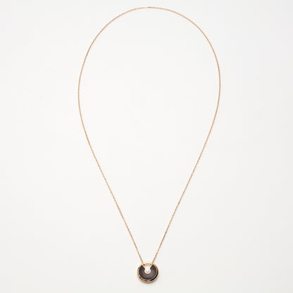 Sautoir Cartier Amulette PM en or rose et bois d'amourette