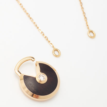 Sautoir Cartier Amulette PM en or rose et bois d'amourette